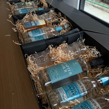 Load image into Gallery viewer, Bottle of Ti Kôuka Forest Gin with two bottles of Fever-Tree Elderflower Tonic Water