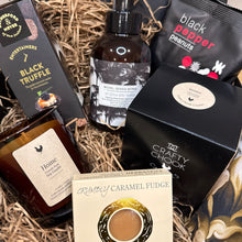 Load image into Gallery viewer, Gift basket with various items including a bottle, crackers, and a box of fudge.