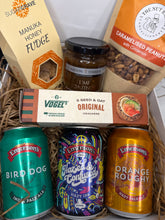 Load image into Gallery viewer, Gift basket with various items including beer cans, a box of fudge, and a jar of pickle