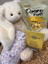 Load image into Gallery viewer, Gift box popcorn treats and fudge with a plush toy and floral blanket for a baby gift