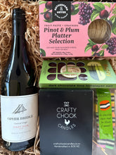 Load image into Gallery viewer, Gift basket with wine, platter selection, and a boxed scented candle.
